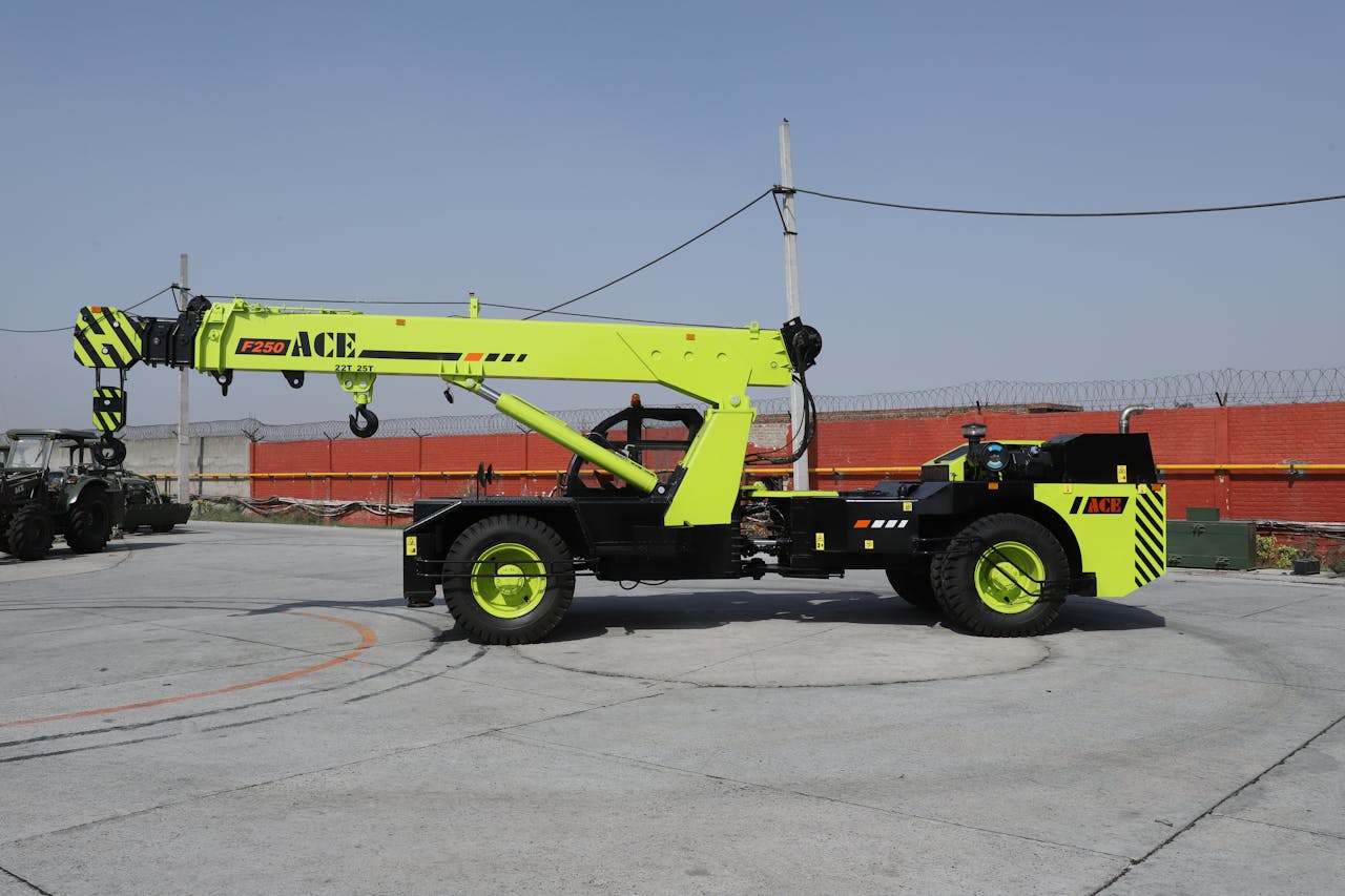 ACE F250 mobile crane in an outdoor industrial site, perfect for construction projects.