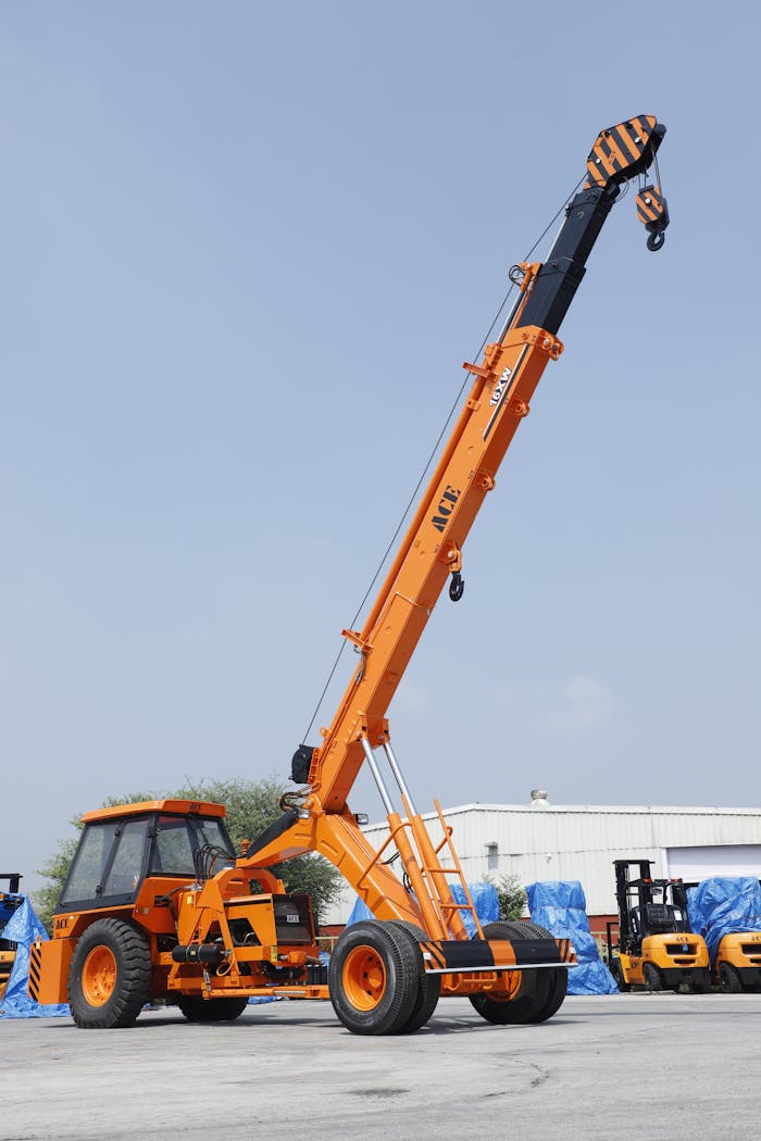 Elevated view of ACE mobile crane used in industrial construction in Faridabad, India.