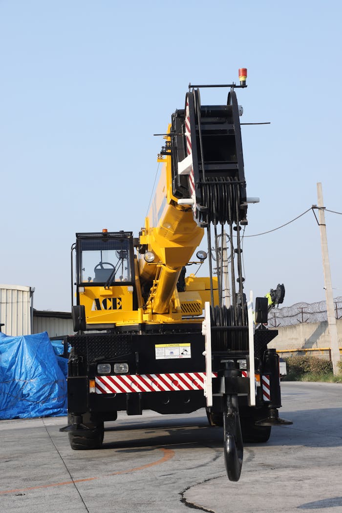 40-ton ACE mobile crane parked in Faridabad, industrial setting.